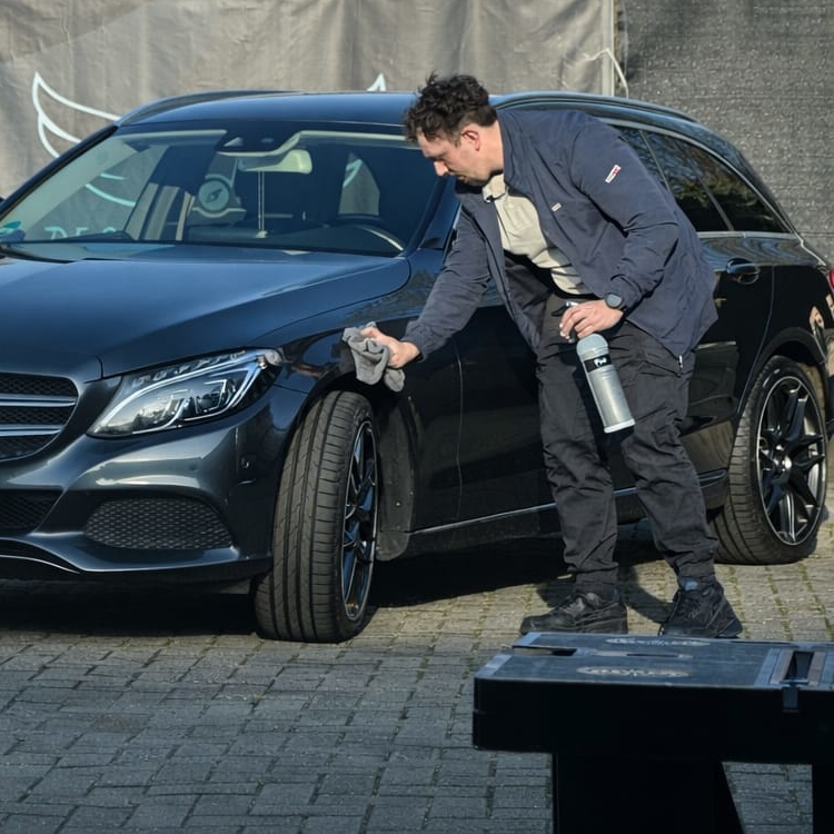 Detailing expert working on a car